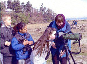 Participants line up to observe birds