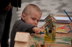participant constructs and paints bird house