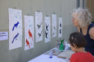 participants display their artwork of birds