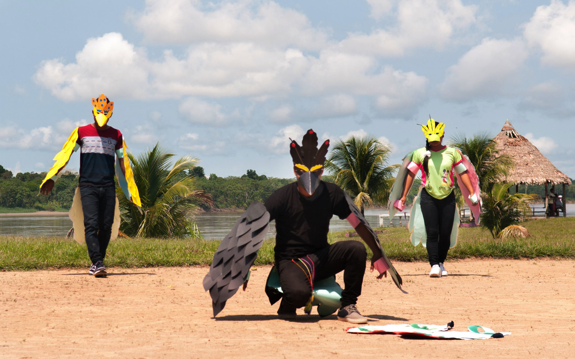 Youth dressed as birds during outdoor play